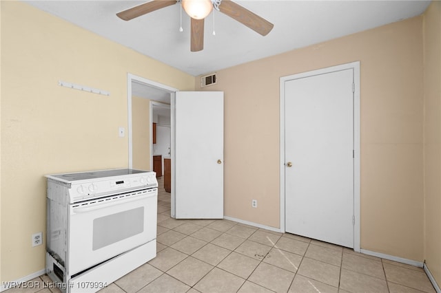 kitchen featuring visible vents, white electric range, baseboards, a ceiling fan, and light tile patterned floors