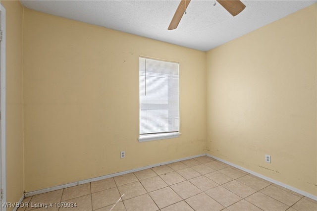 unfurnished room with a textured ceiling and ceiling fan