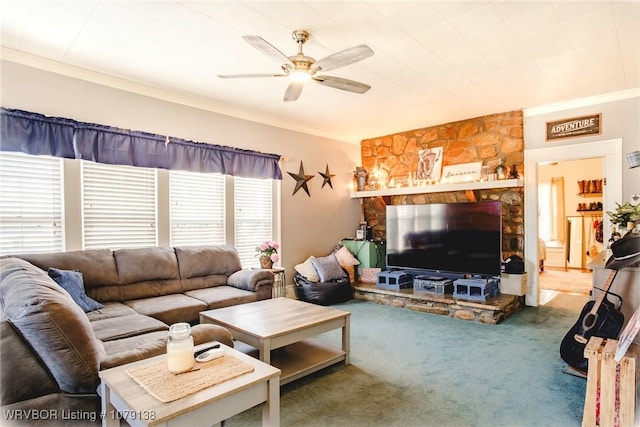 carpeted living area with ornamental molding and a ceiling fan