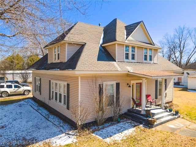 view of front of house with roof with shingles