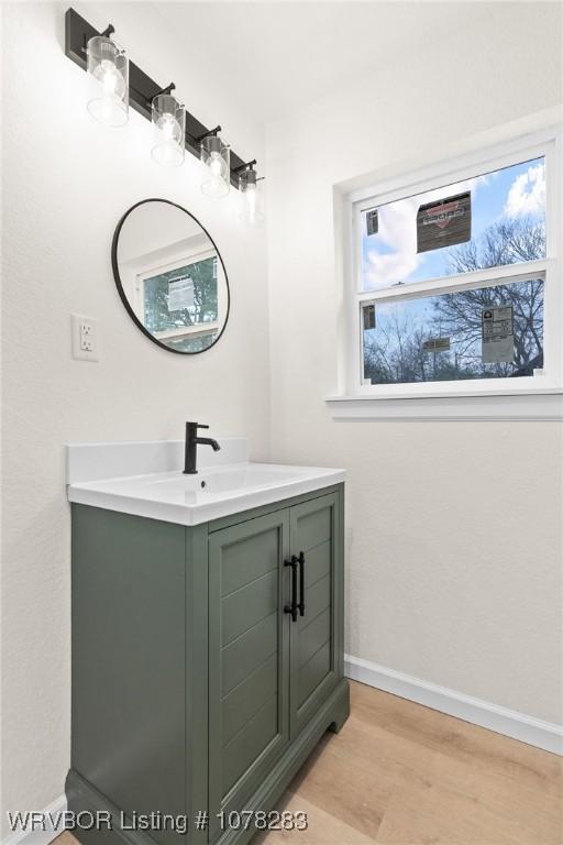 48 W Gary St, Greenwood, AR 72936 - bathroom with vanity and hardwood / wood-style flooring