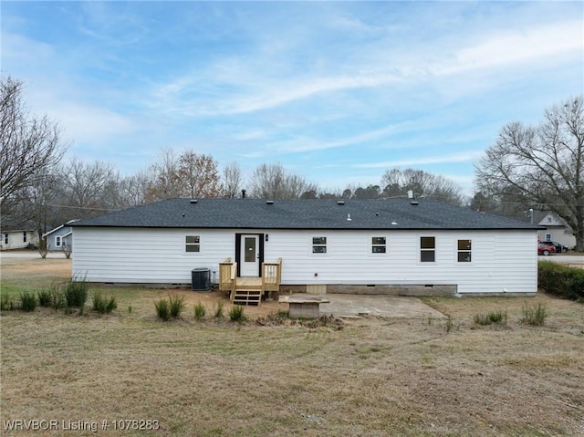 48 W Gary St, Greenwood, AR 72936 - back of property featuring a patio, central AC unit, and a lawn