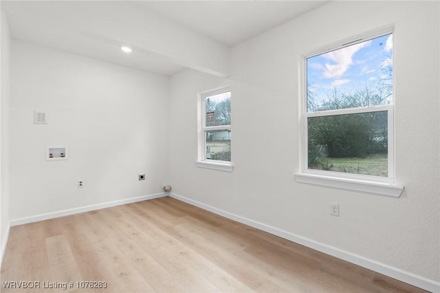 48 W Gary St, Greenwood, AR 72936 - interior space featuring hookup for a washing machine, light hardwood / wood-style floors, and electric dryer hookup
