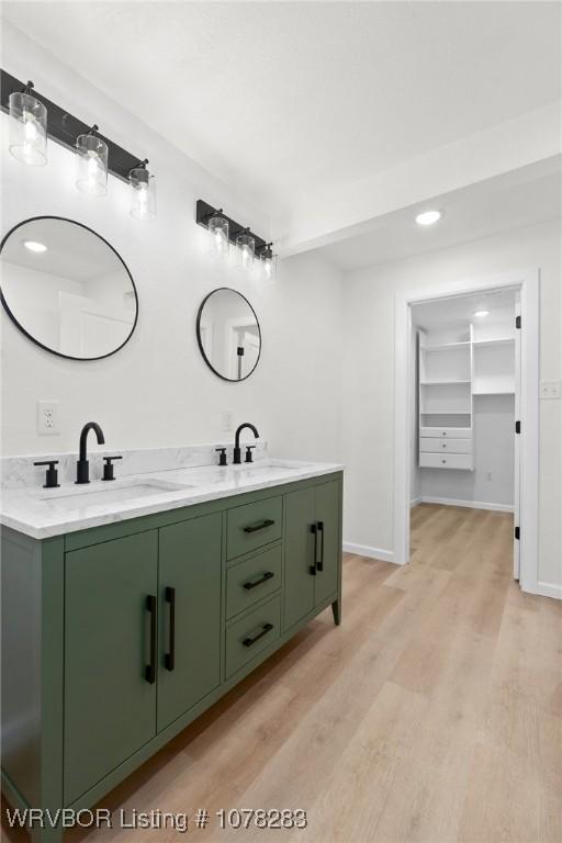 48 W Gary St, Greenwood, AR 72936 - bathroom with vanity and wood-type flooring