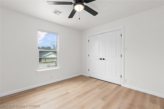 48 W Gary St, Greenwood, AR 72936 - unfurnished bedroom featuring ceiling fan, a closet, and light wood-type flooring