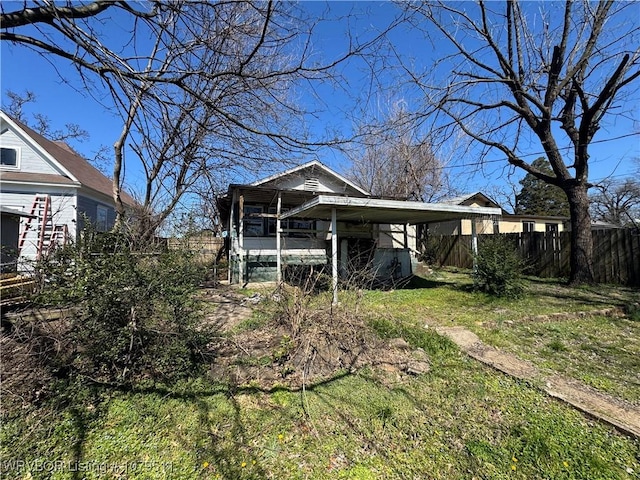 exterior space with a yard and fence