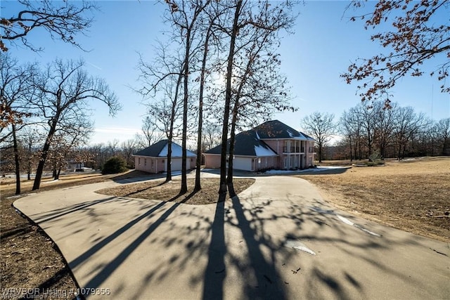 view of front of property featuring driveway and a garage