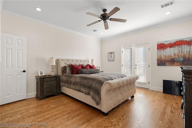 bedroom featuring light wood-style flooring, visible vents, access to outside, and ornamental molding