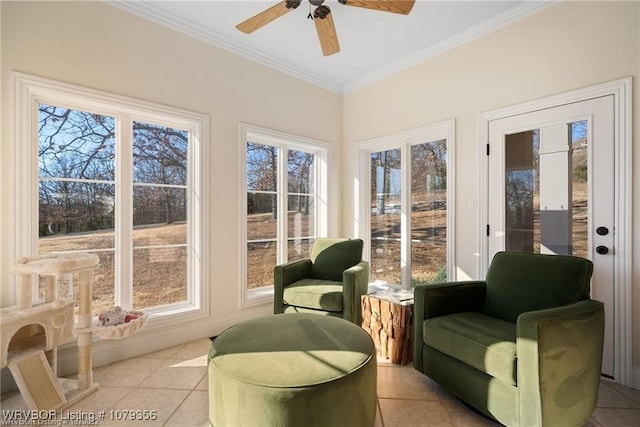 sunroom / solarium with a ceiling fan