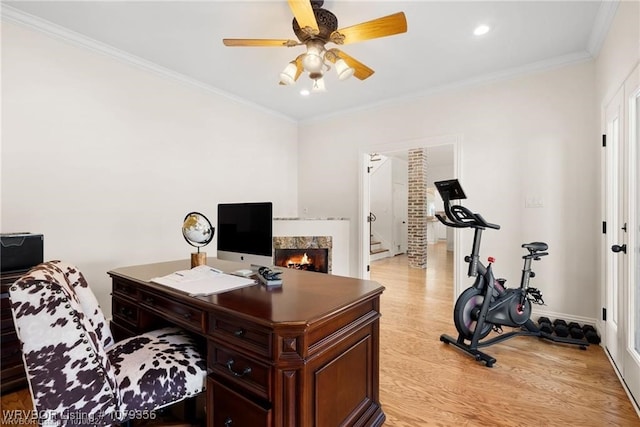 office space with light wood finished floors, baseboards, a ceiling fan, crown molding, and recessed lighting