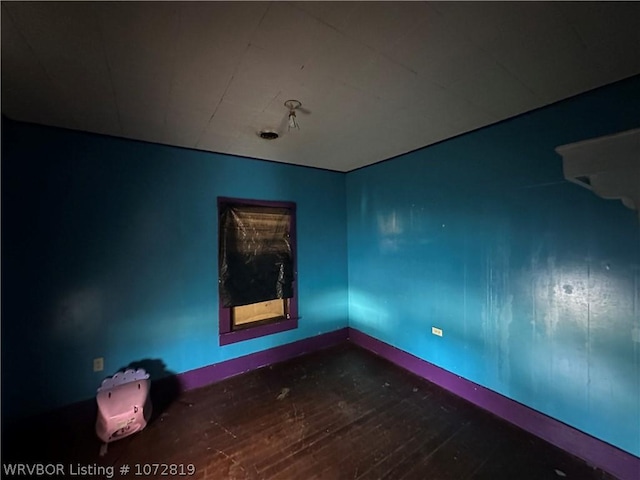 empty room featuring wood-type flooring