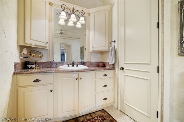 bathroom featuring vanity, tile patterned floors, ceiling fan, and crown molding