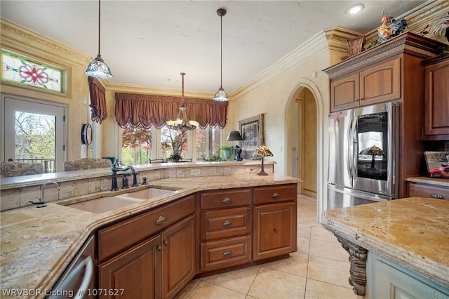 kitchen featuring sink, appliances with stainless steel finishes, decorative light fixtures, light tile patterned flooring, and ornamental molding