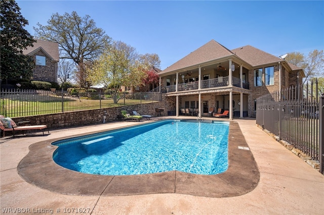 view of pool with a patio area and ceiling fan