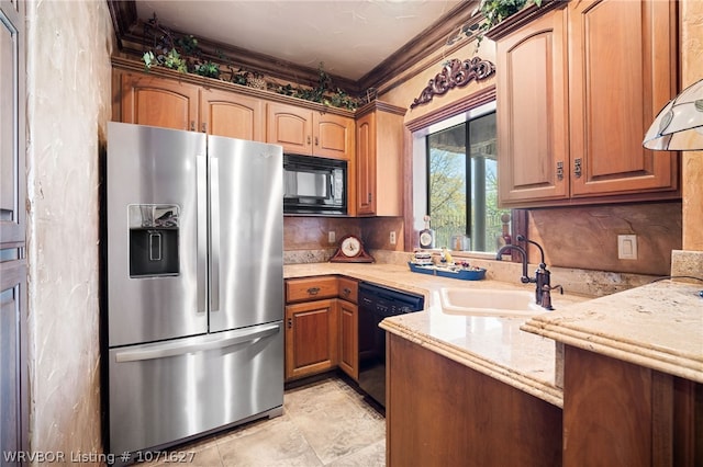 kitchen featuring light stone countertops, crown molding, exhaust hood, sink, and black appliances