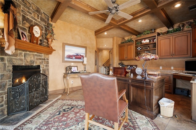 tiled home office with a fireplace, beam ceiling, ceiling fan, and coffered ceiling