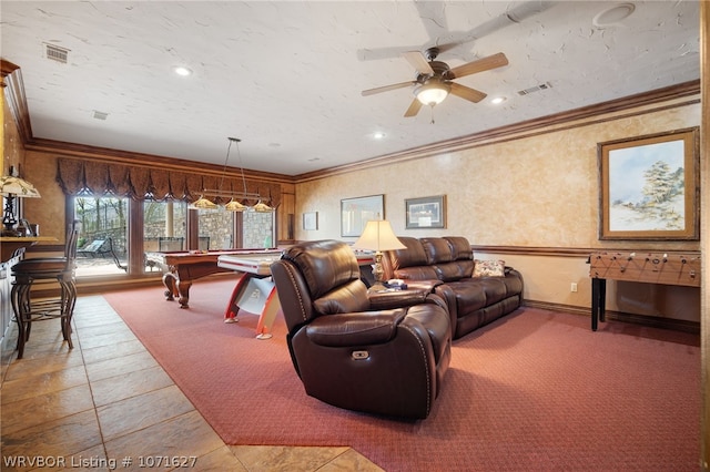 living room with carpet flooring, ceiling fan, crown molding, and pool table