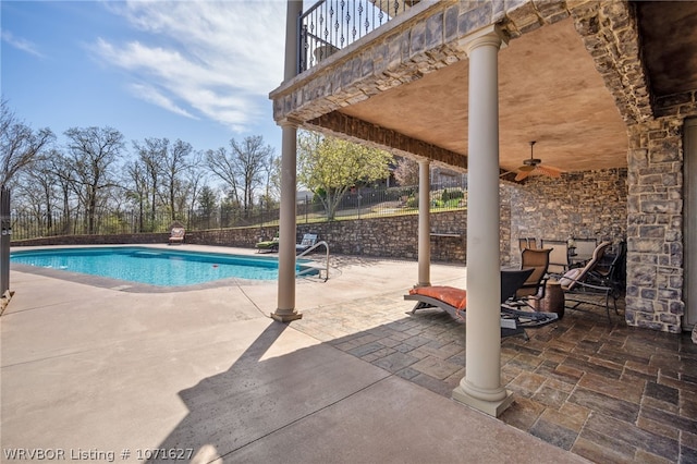 view of pool with a patio area and ceiling fan