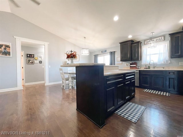 527 Polk Road 59, Mena, AR 71953 - kitchen with vaulted ceiling, light countertops, dark wood finished floors, a center island, and decorative light fixtures