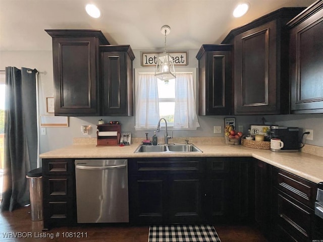527 Polk Road 59, Mena, AR 71953 - kitchen featuring stainless steel dishwasher, a sink, light countertops, and decorative light fixtures