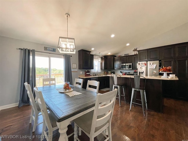 527 Polk Road 59, Mena, AR 71953 - dining space with dark wood finished floors, baseboards, recessed lighting, and a chandelier