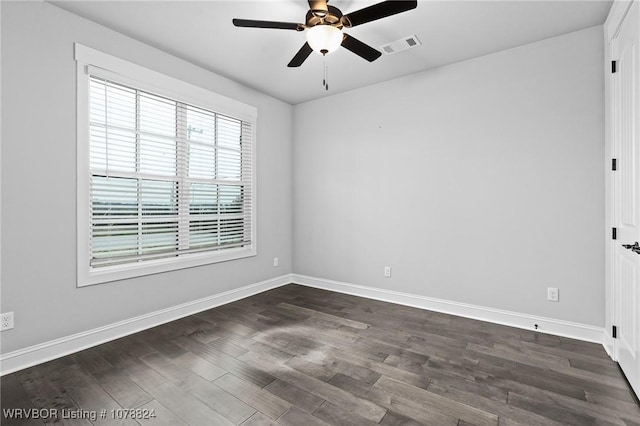 unfurnished room with dark wood-type flooring and ceiling fan