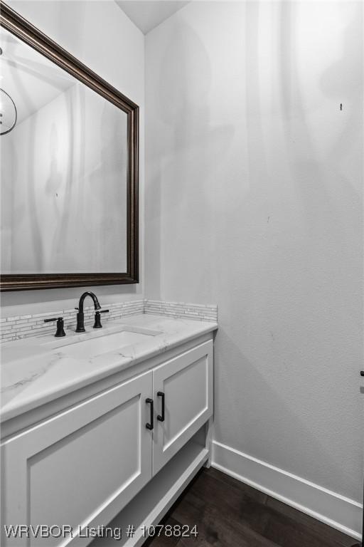 bathroom with wood-type flooring and vanity