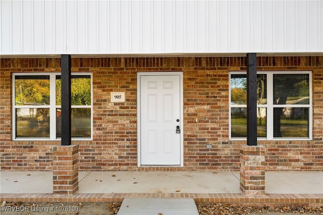 doorway to property with a porch