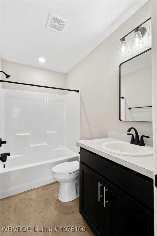 full bathroom featuring shower / tub combination, vanity, and toilet