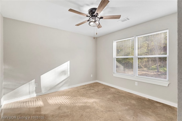 empty room with carpet flooring and ceiling fan