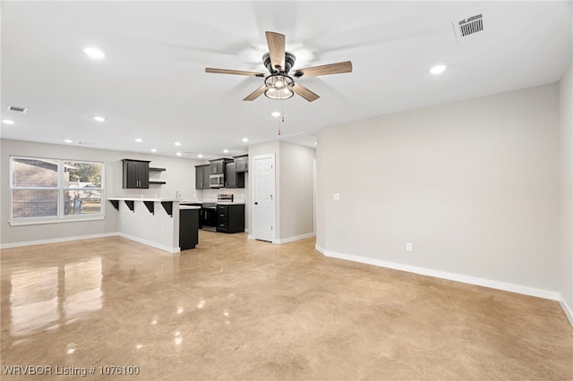 unfurnished living room with ceiling fan