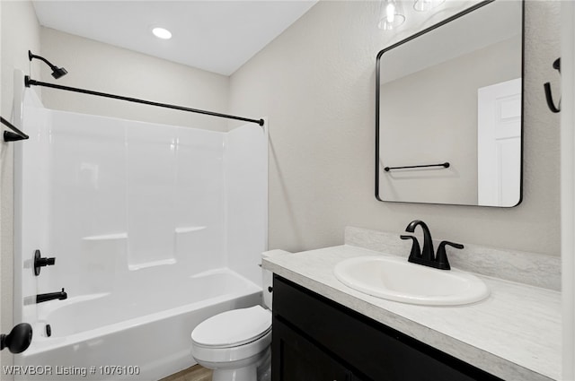 full bathroom with toilet, vanity, and tub / shower combination