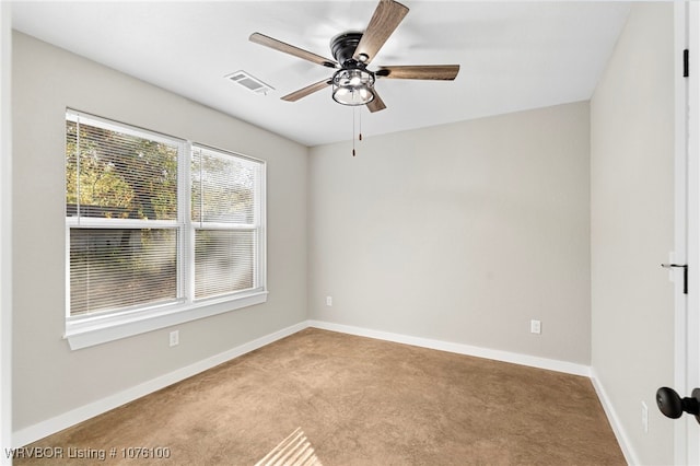 empty room with light carpet and ceiling fan