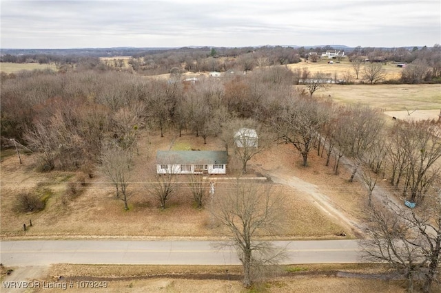 birds eye view of property with a rural view