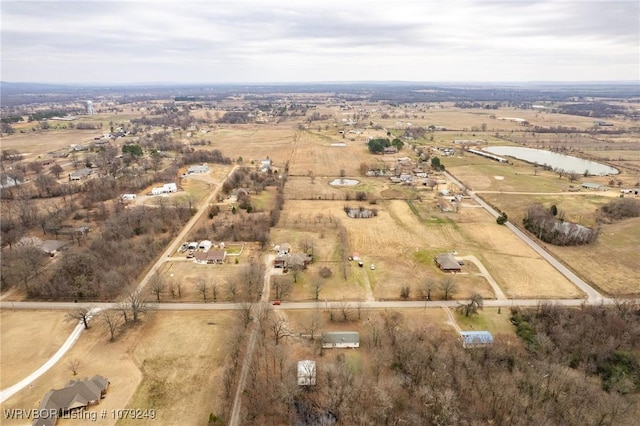 birds eye view of property with a rural view