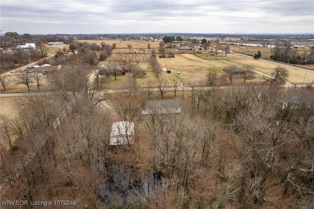 birds eye view of property featuring a rural view