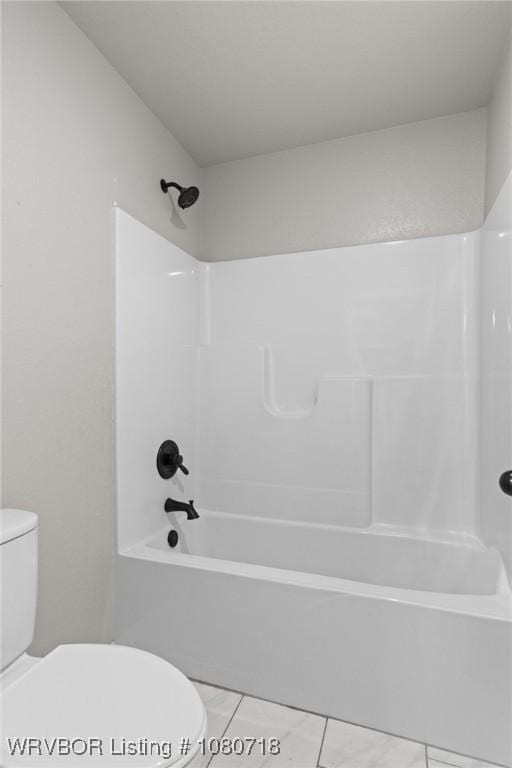 full bathroom featuring tile patterned floors, toilet, and tub / shower combination