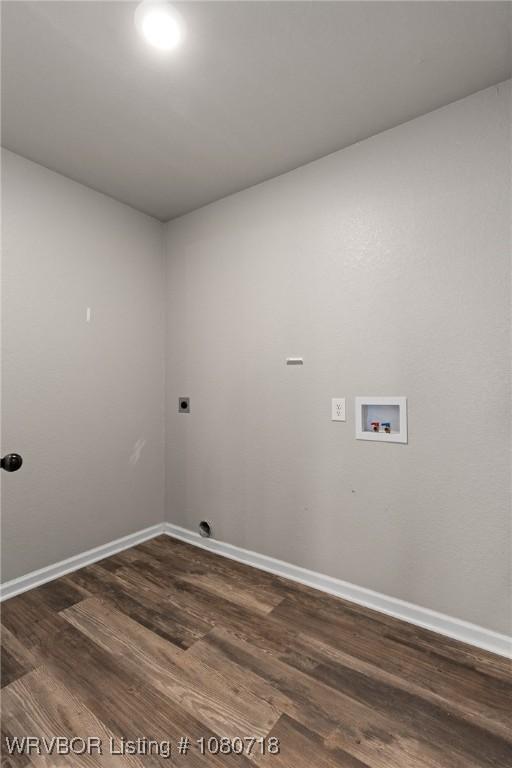 washroom with laundry area, baseboards, washer hookup, and dark wood-style floors