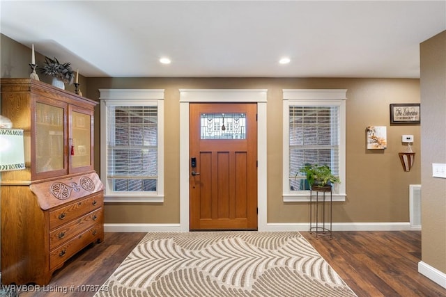 entrance foyer with dark hardwood / wood-style floors