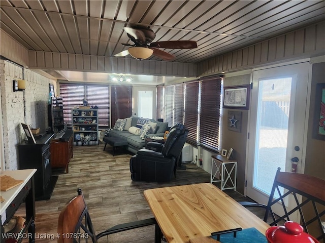 living room with hardwood / wood-style floors and ceiling fan