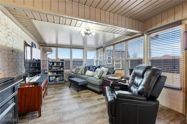 sunroom with an inviting chandelier