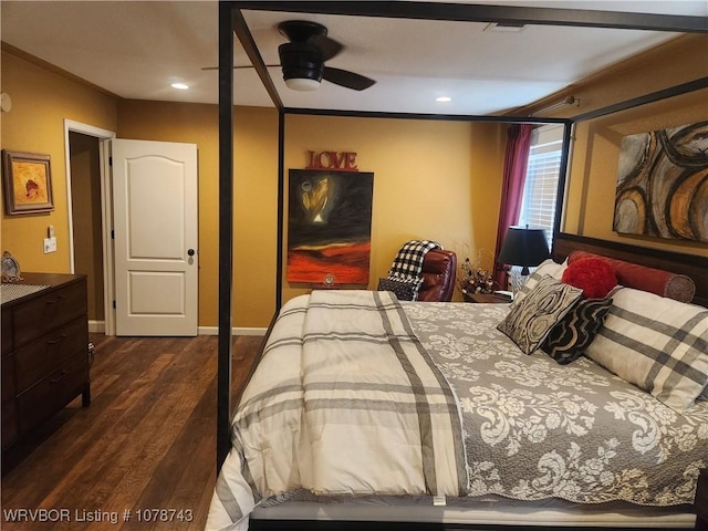 bedroom with dark hardwood / wood-style floors