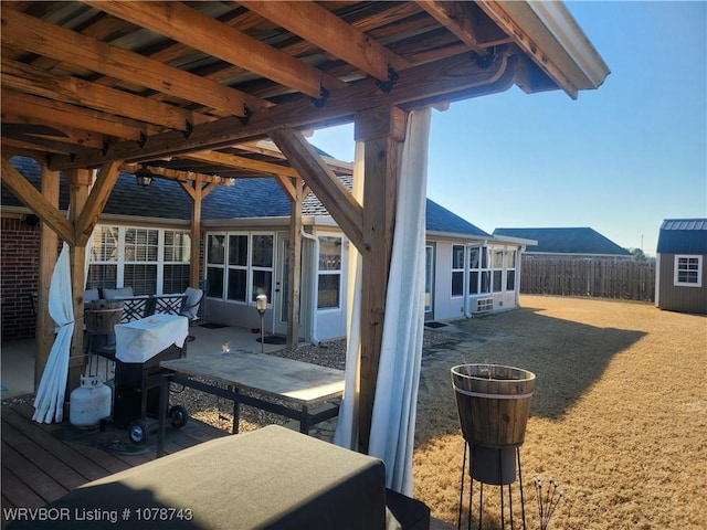 view of patio featuring a storage shed