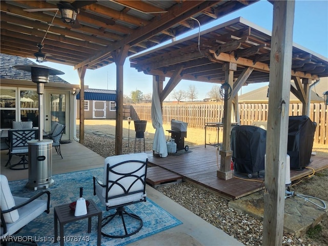 view of patio / terrace with a wooden deck and grilling area