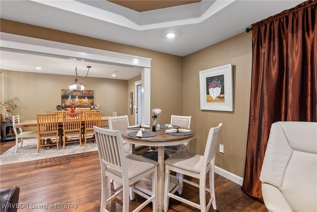 dining area featuring dark hardwood / wood-style floors