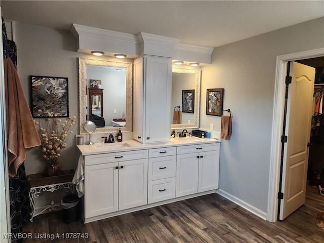 bathroom featuring vanity and hardwood / wood-style floors