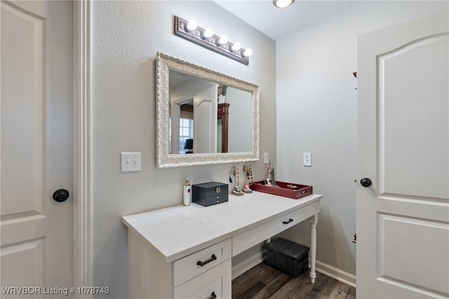 bathroom with hardwood / wood-style flooring