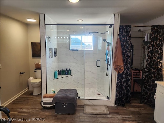 bathroom with vanity, wood-type flooring, toilet, and walk in shower