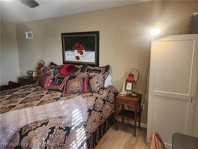 bedroom with light hardwood / wood-style flooring