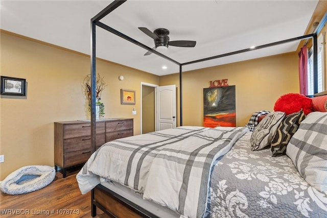 bedroom featuring wood-type flooring and ceiling fan